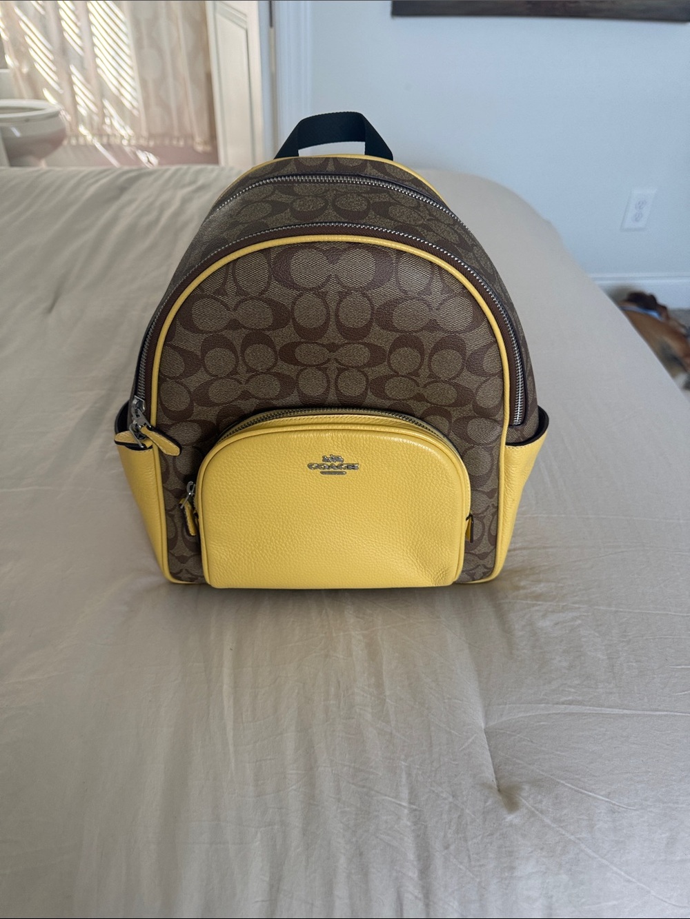 Coach Brown Signature Backpack with Yellow Leather Accents
